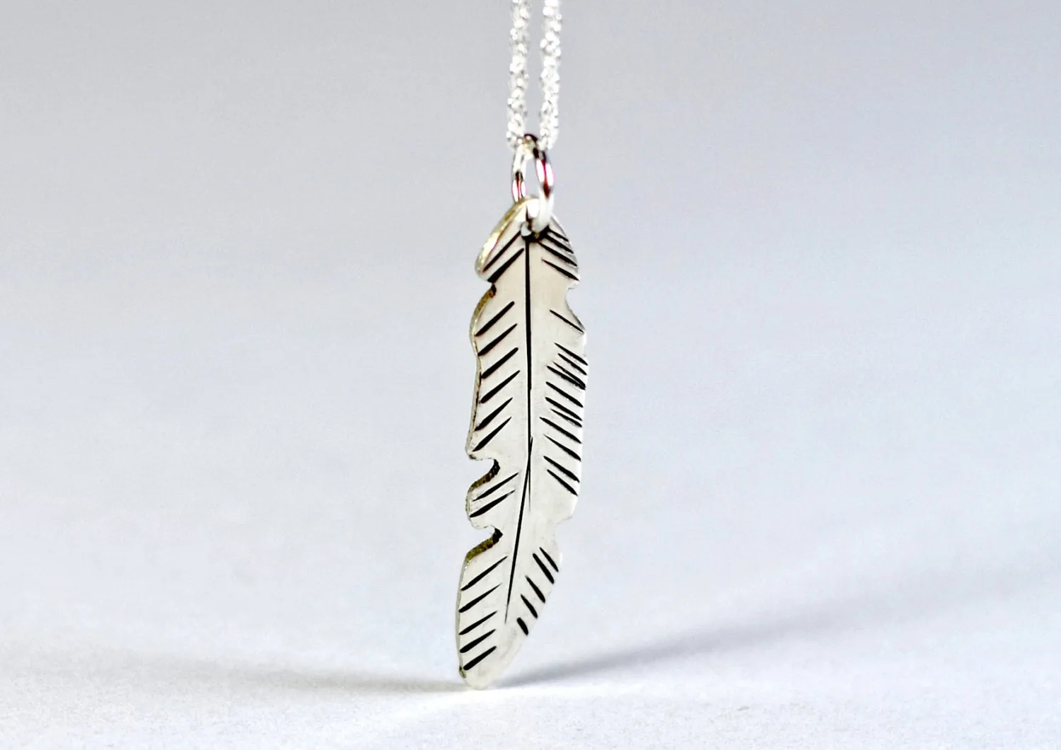 Dainty small sterling silver feather necklace