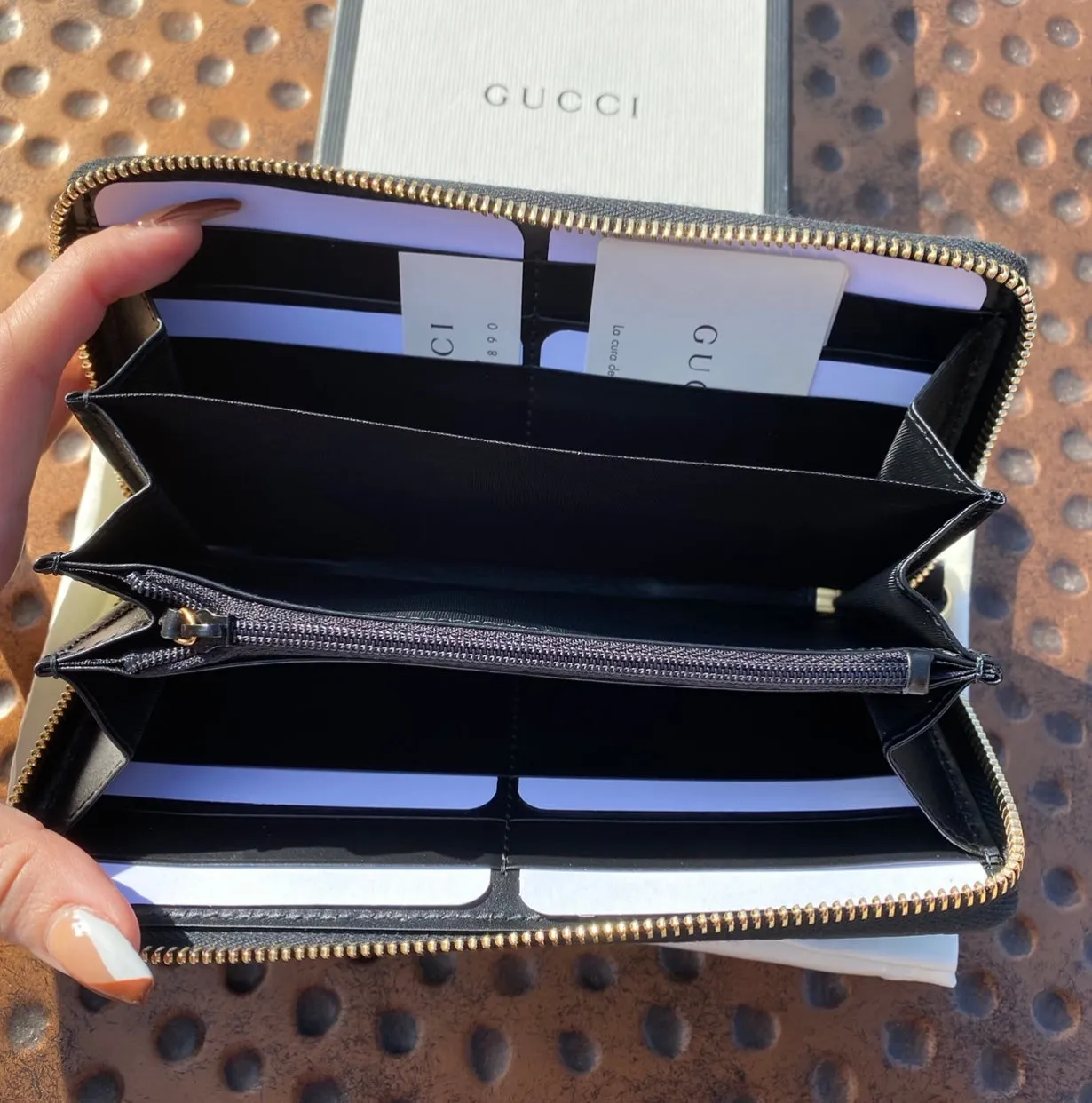 Gucci Interlocking GG Embossed Leather Zip Around Wallet in Black