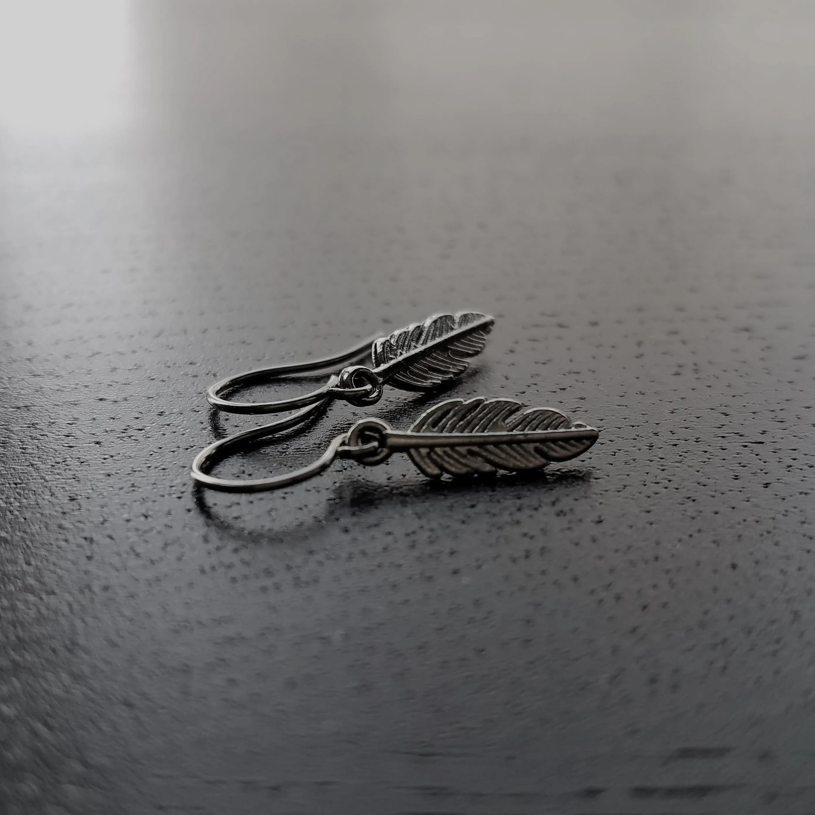 Gunmetal Feather Earrings, blackened silver feather, tiny feather earring, small gun metal feather, little feather dangle, simple feather, silvery black feather earring