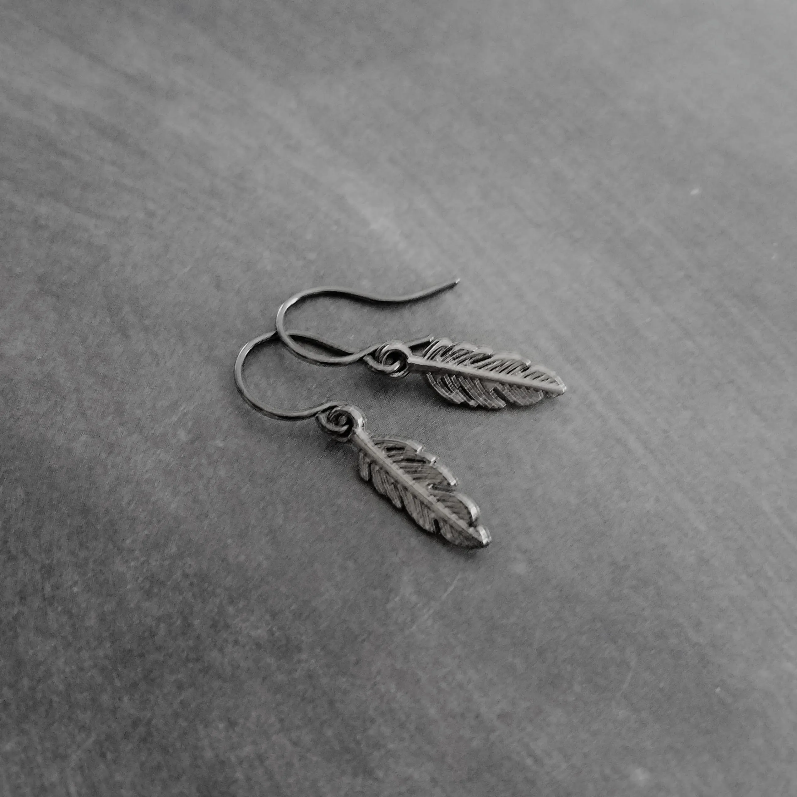 Gunmetal Feather Earrings, blackened silver feather, tiny feather earring, small gun metal feather, little feather dangle, simple feather, silvery black feather earring