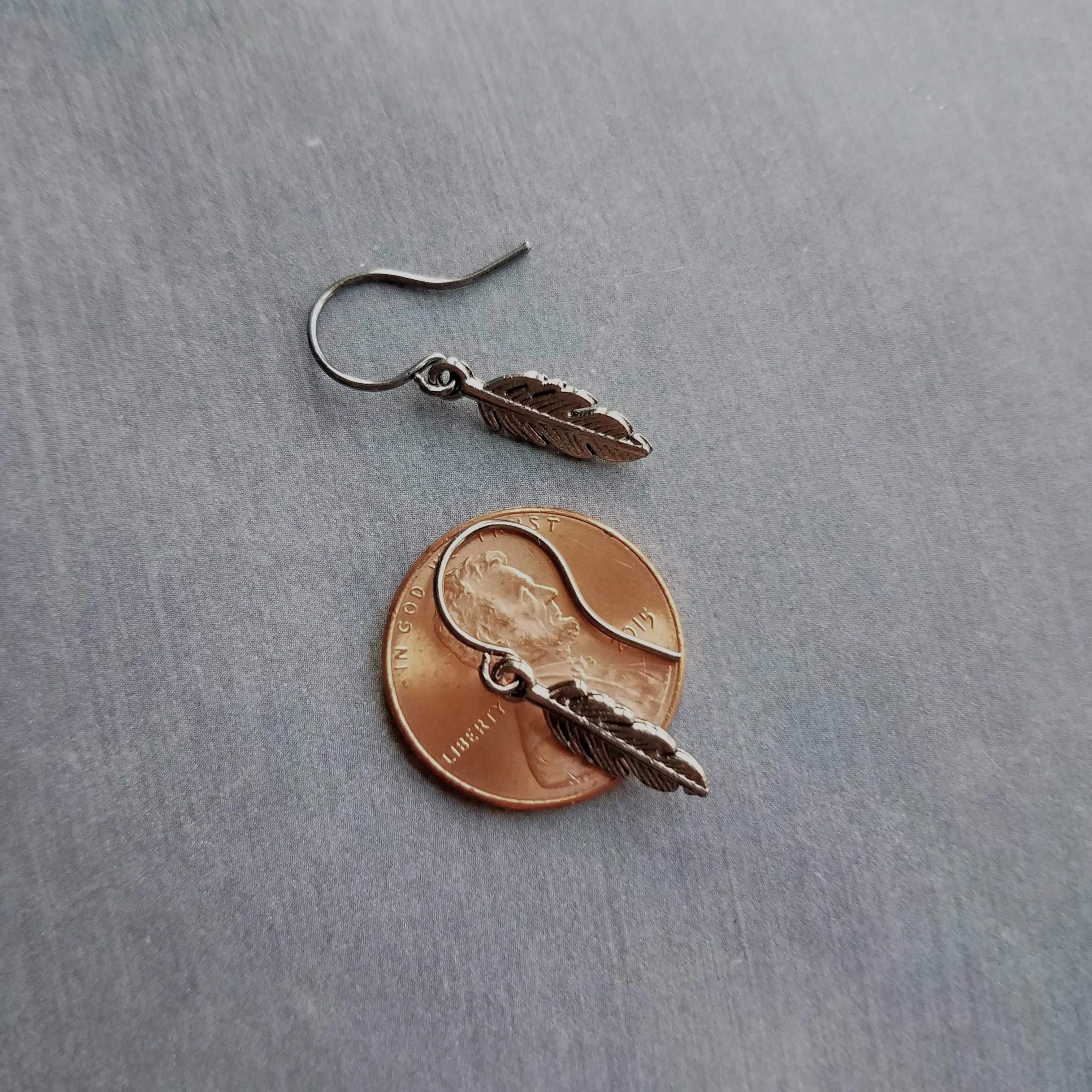 Gunmetal Feather Earrings, blackened silver feather, tiny feather earring, small gun metal feather, little feather dangle, simple feather, silvery black feather earring