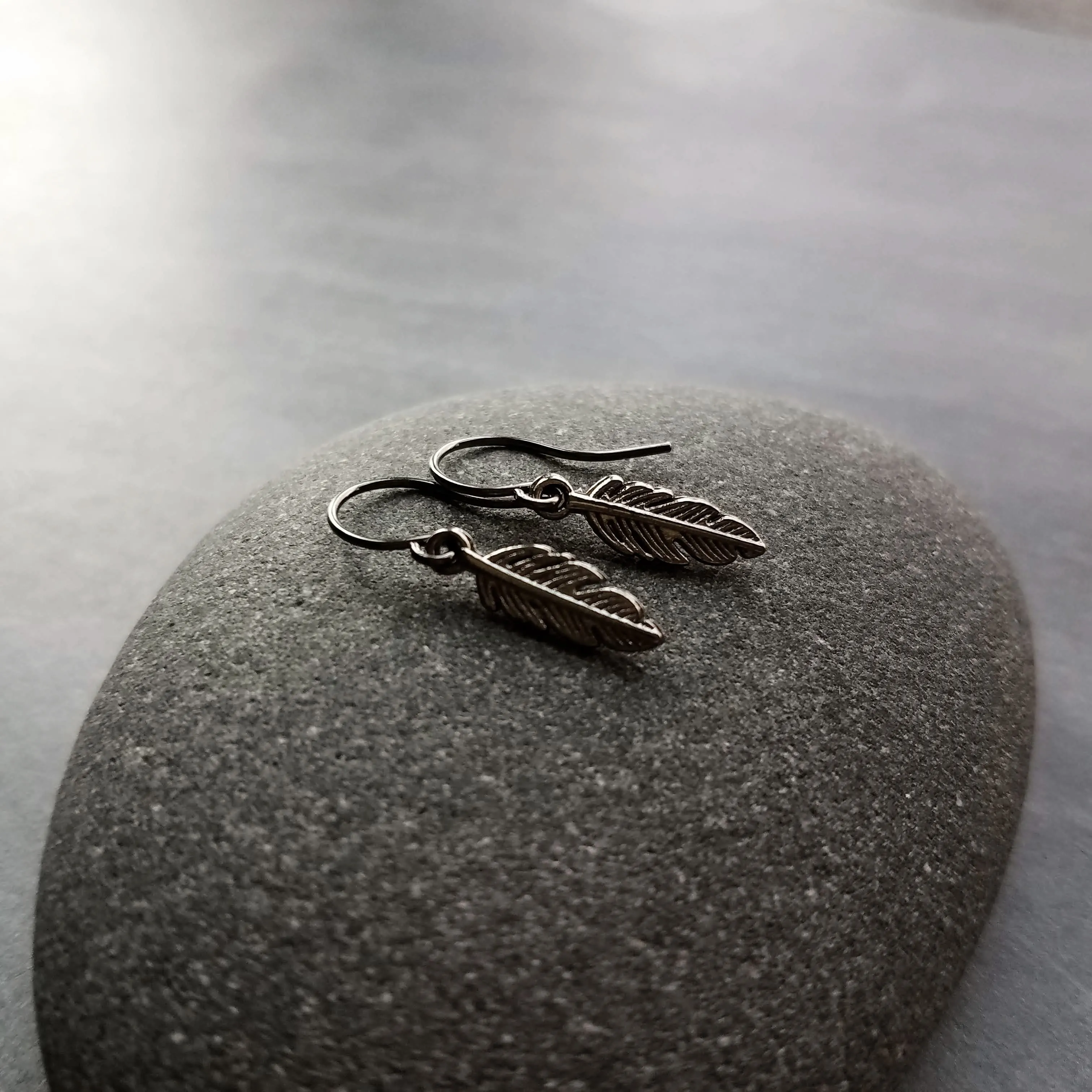 Gunmetal Feather Earrings, blackened silver feather, tiny feather earring, small gun metal feather, little feather dangle, simple feather, silvery black feather earring