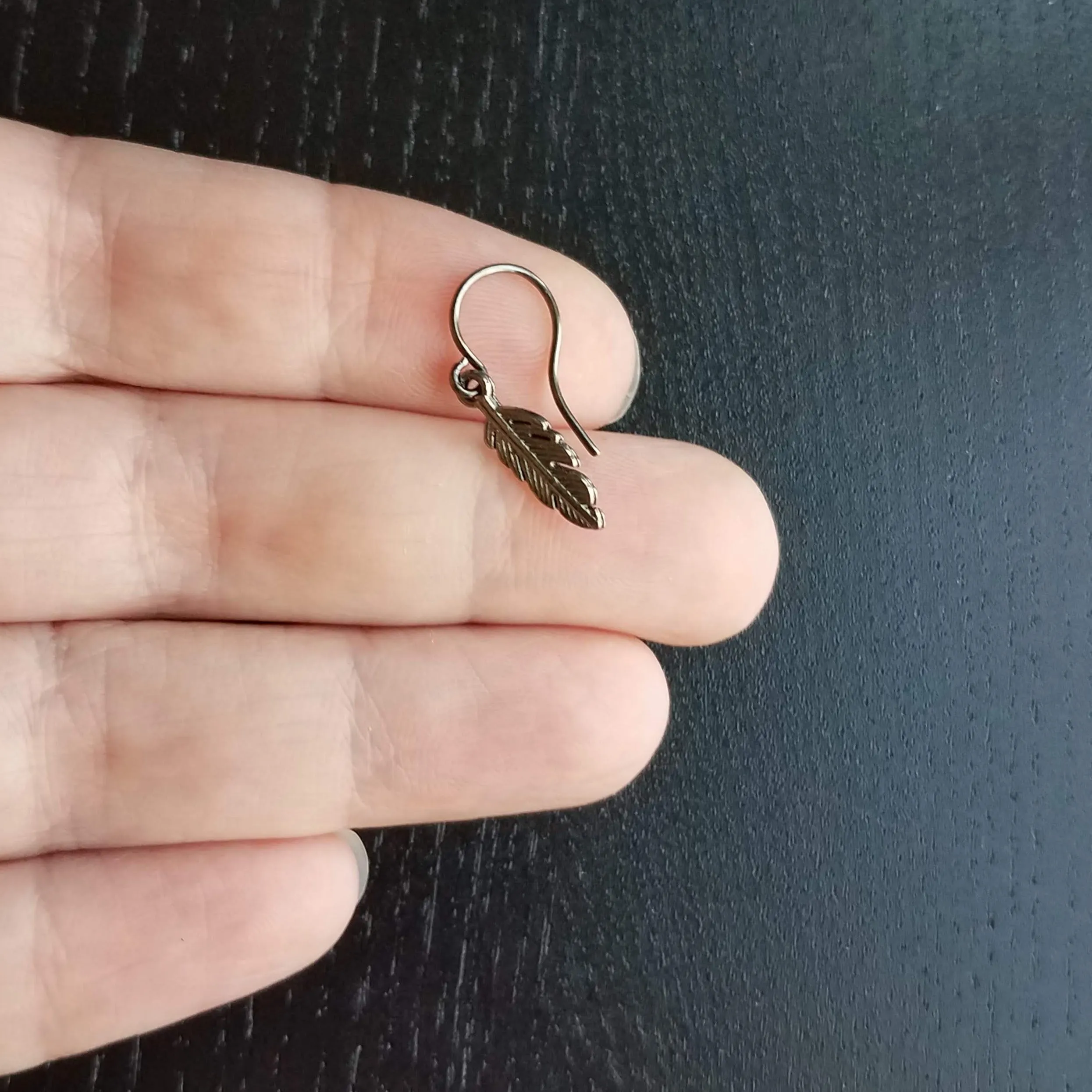 Gunmetal Feather Earrings, blackened silver feather, tiny feather earring, small gun metal feather, little feather dangle, simple feather, silvery black feather earring
