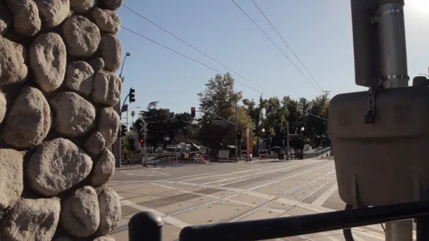 Los Angeles Metro Rail Passes L to R with Sun Flare
