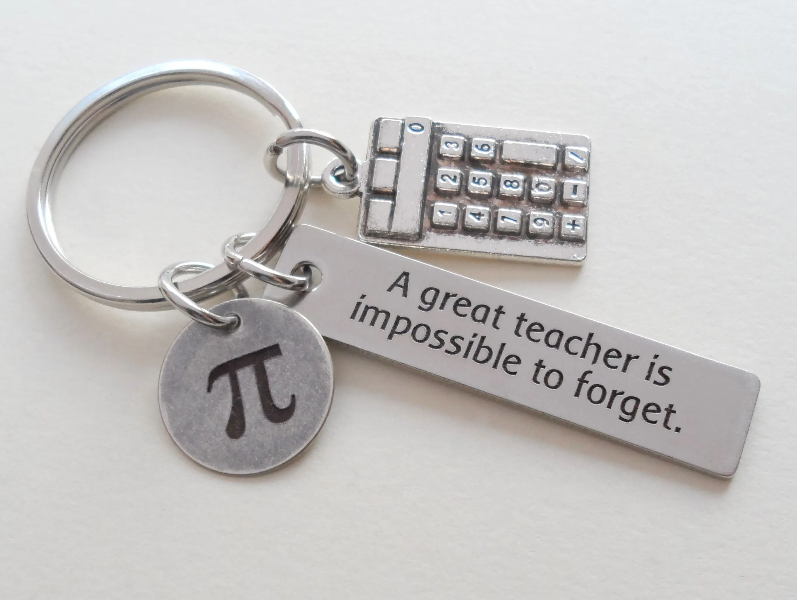 Math Teacher Keychain; Pi, Calculator Charm, and Engraved Rectangle Tag with "A Great Teacher is Impossible to Forget"