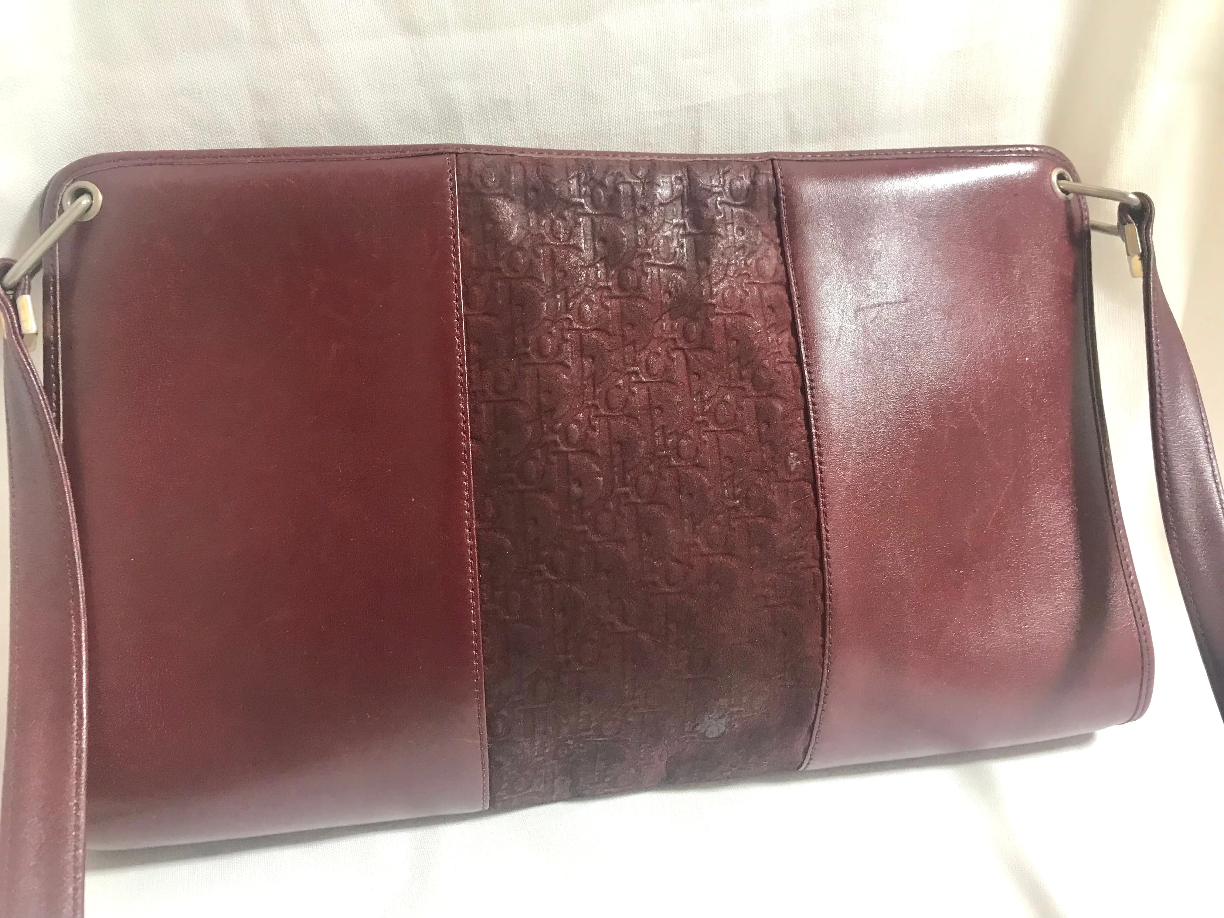 Vintage Christian Dior wine red leather clutch shoulder bag with engraved logo at center. Classic and beautiful purse. 060905r4