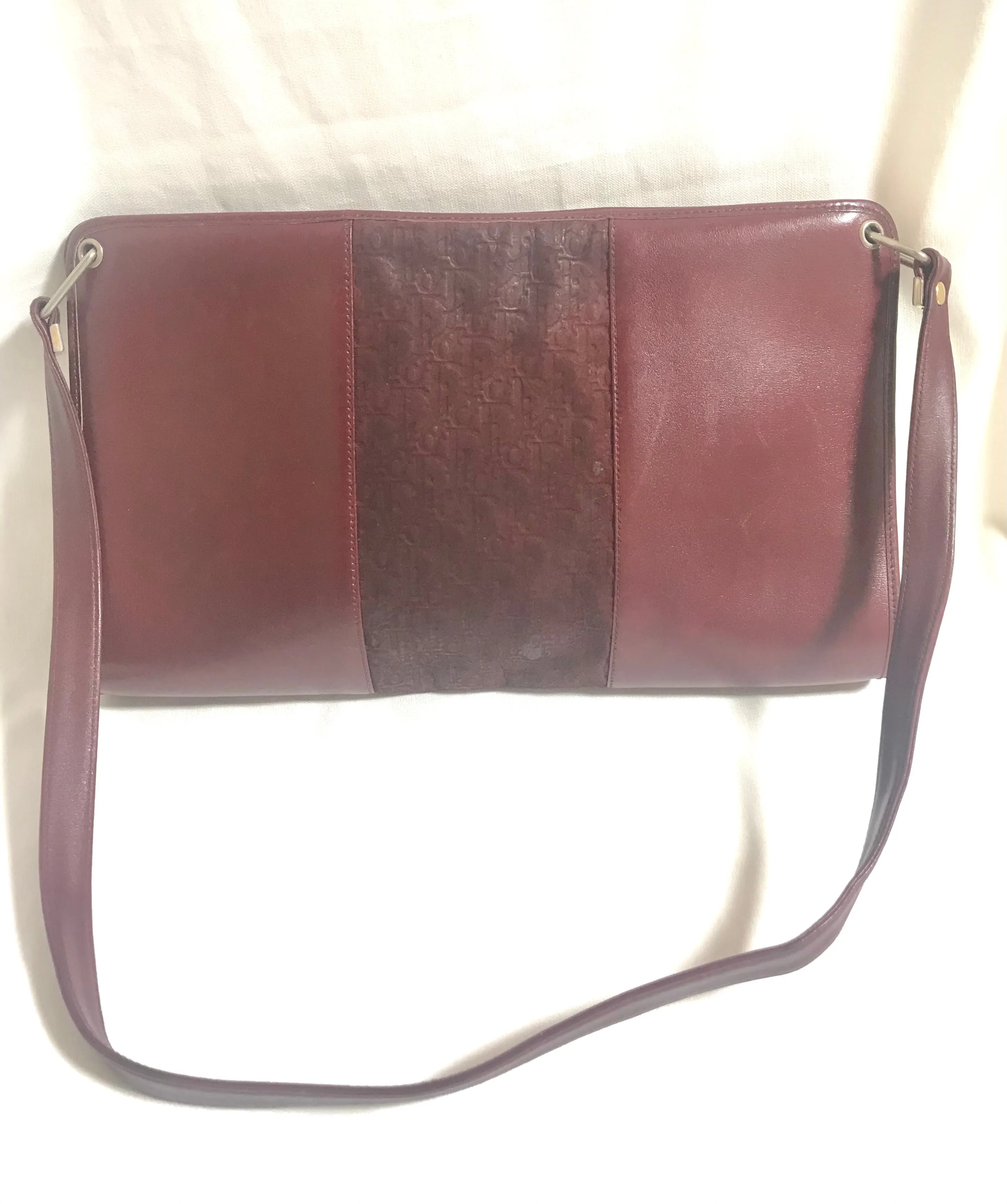 Vintage Christian Dior wine red leather clutch shoulder bag with engraved logo at center. Classic and beautiful purse. 060905r4