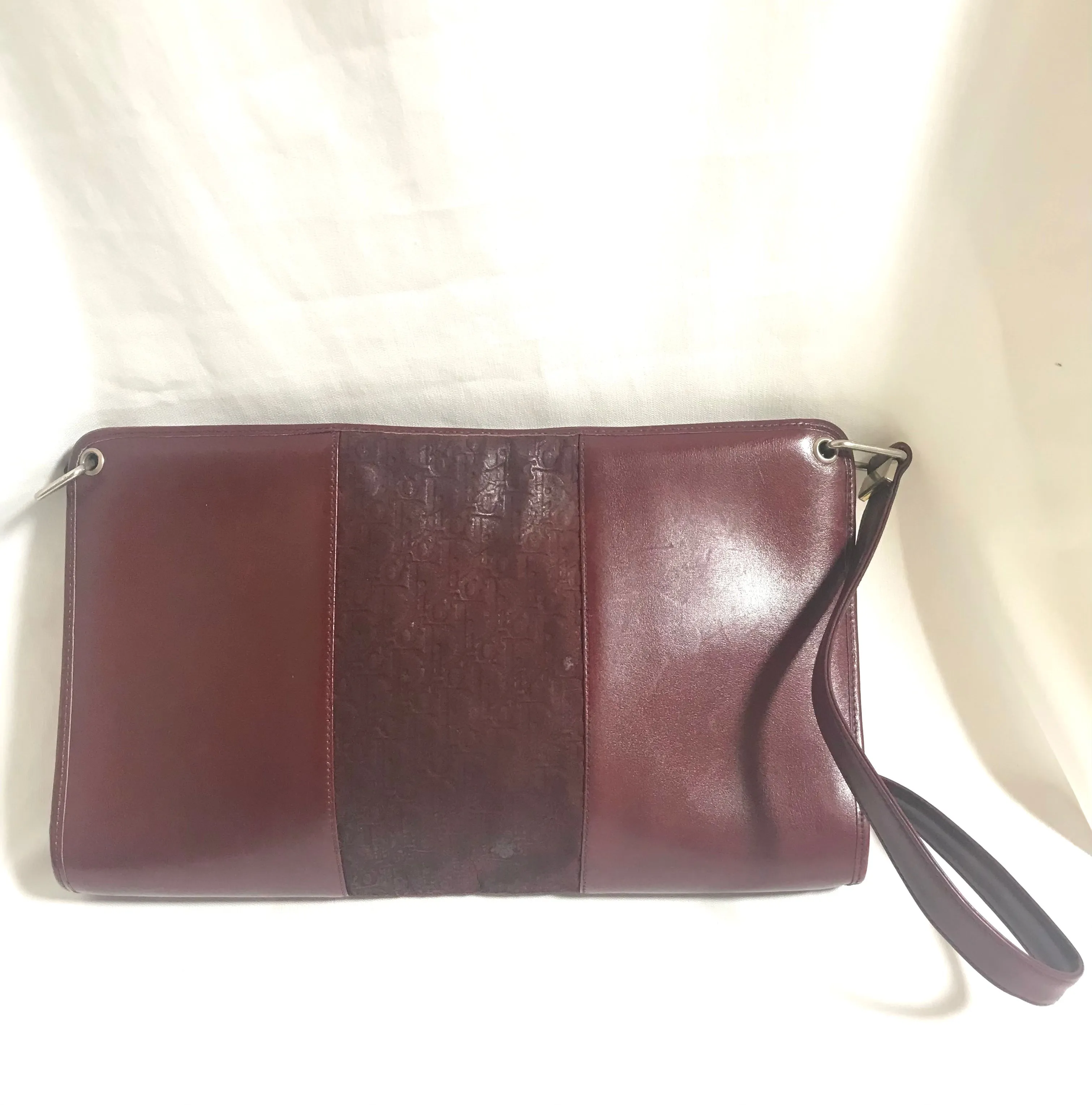 Vintage Christian Dior wine red leather clutch shoulder bag with engraved logo at center. Classic and beautiful purse. 060905r4
