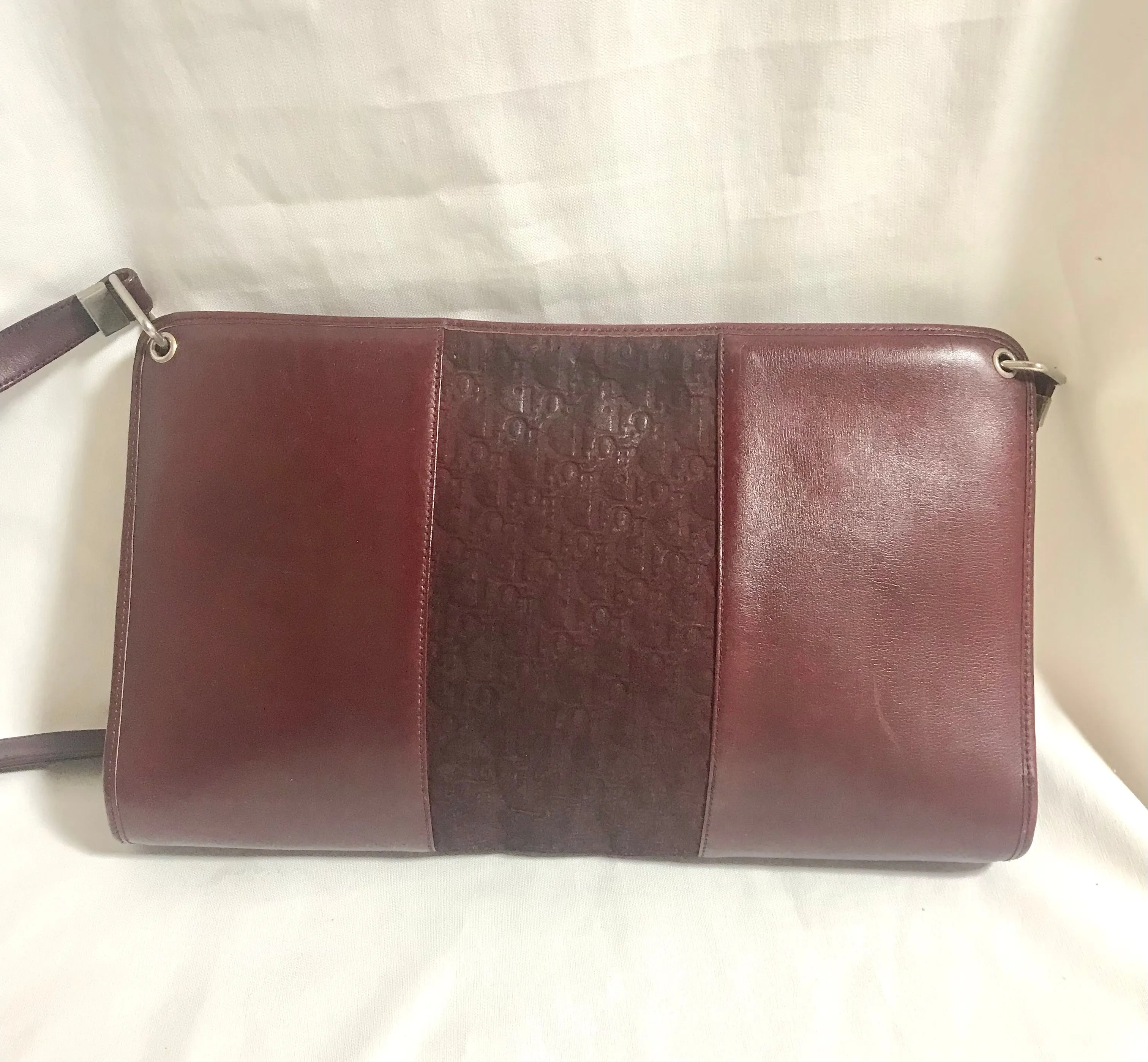 Vintage Christian Dior wine red leather clutch shoulder bag with engraved logo at center. Classic and beautiful purse. 060905r4
