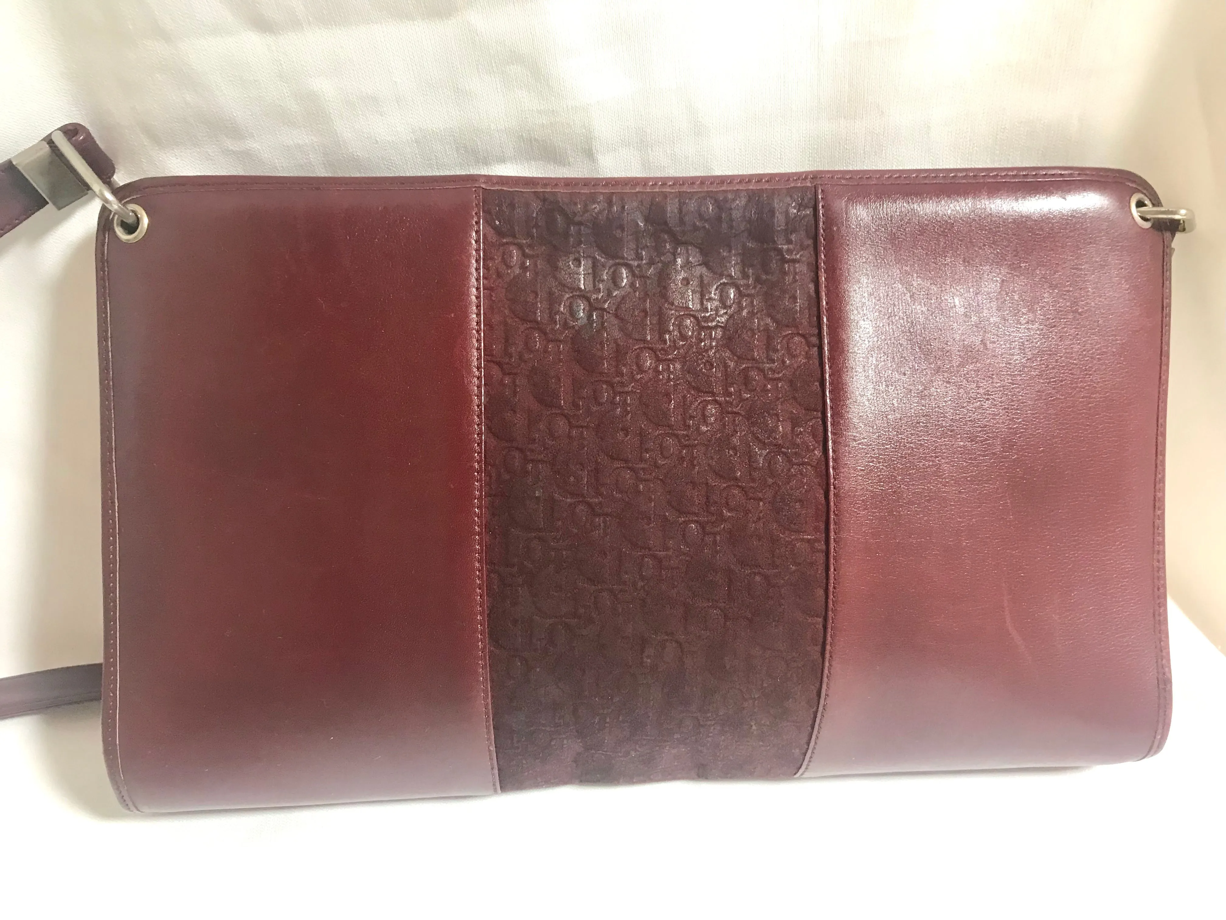 Vintage Christian Dior wine red leather clutch shoulder bag with engraved logo at center. Classic and beautiful purse. 060905r4