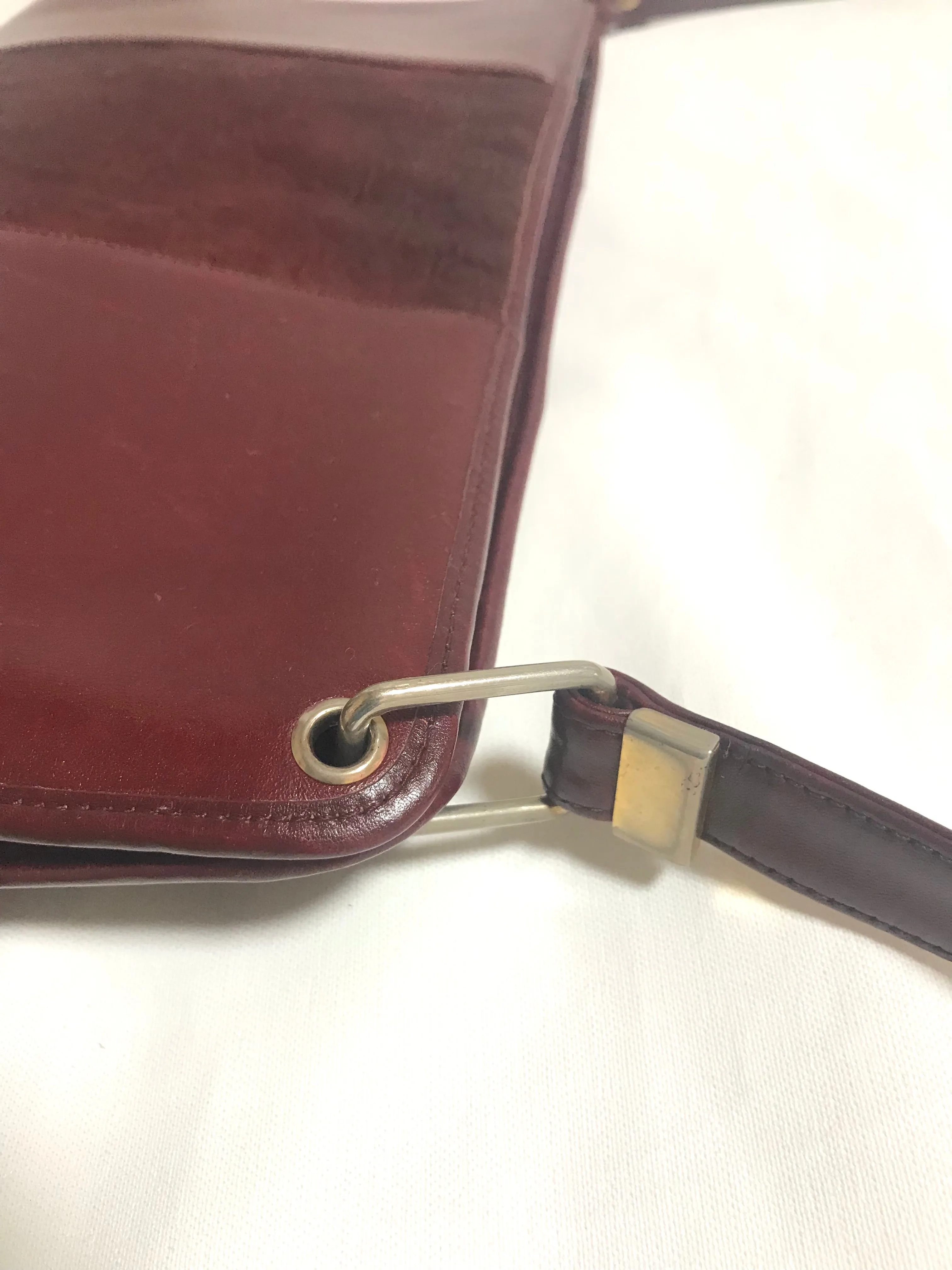 Vintage Christian Dior wine red leather clutch shoulder bag with engraved logo at center. Classic and beautiful purse. 060905r4