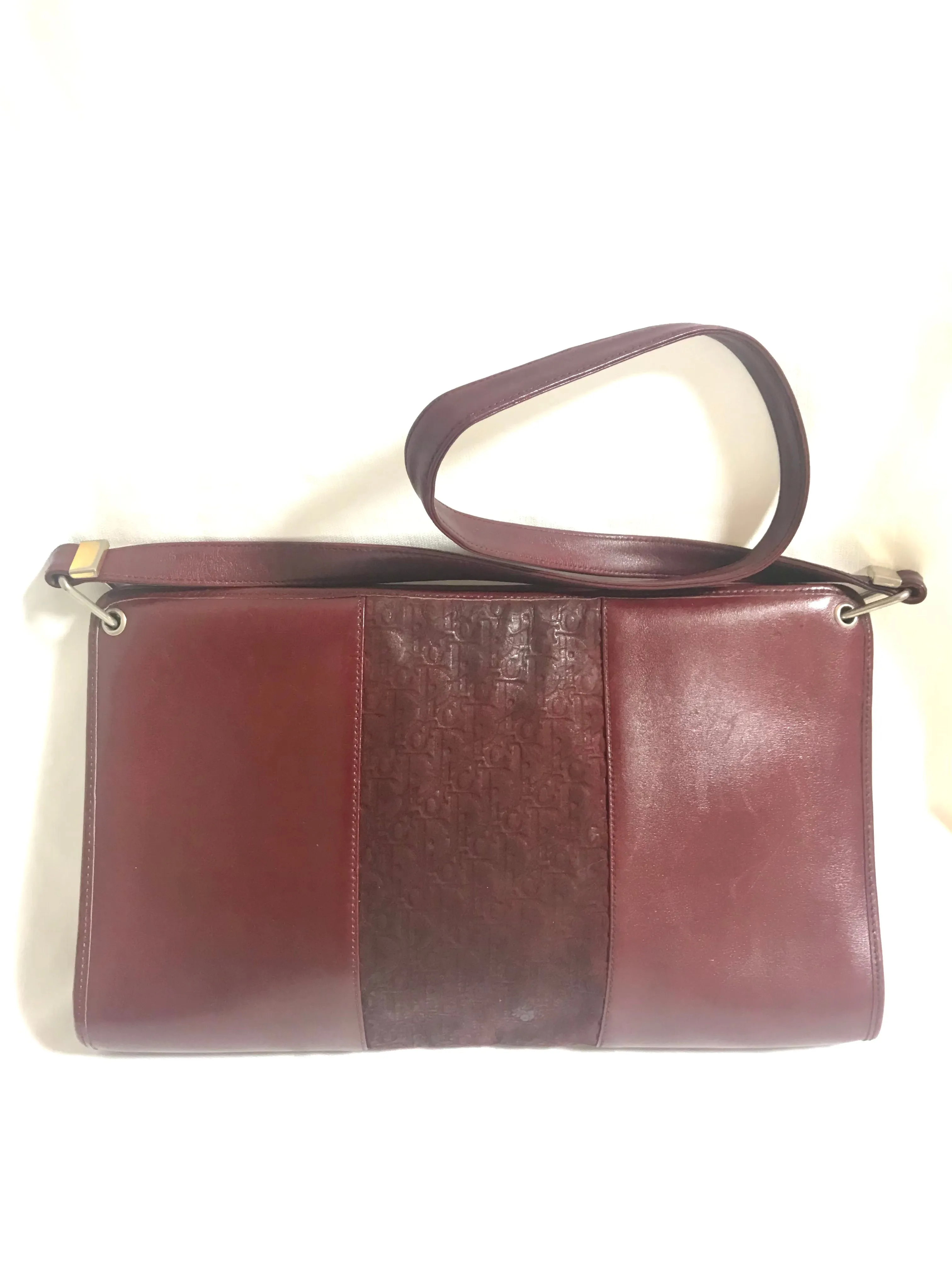 Vintage Christian Dior wine red leather clutch shoulder bag with engraved logo at center. Classic and beautiful purse. 060905r4