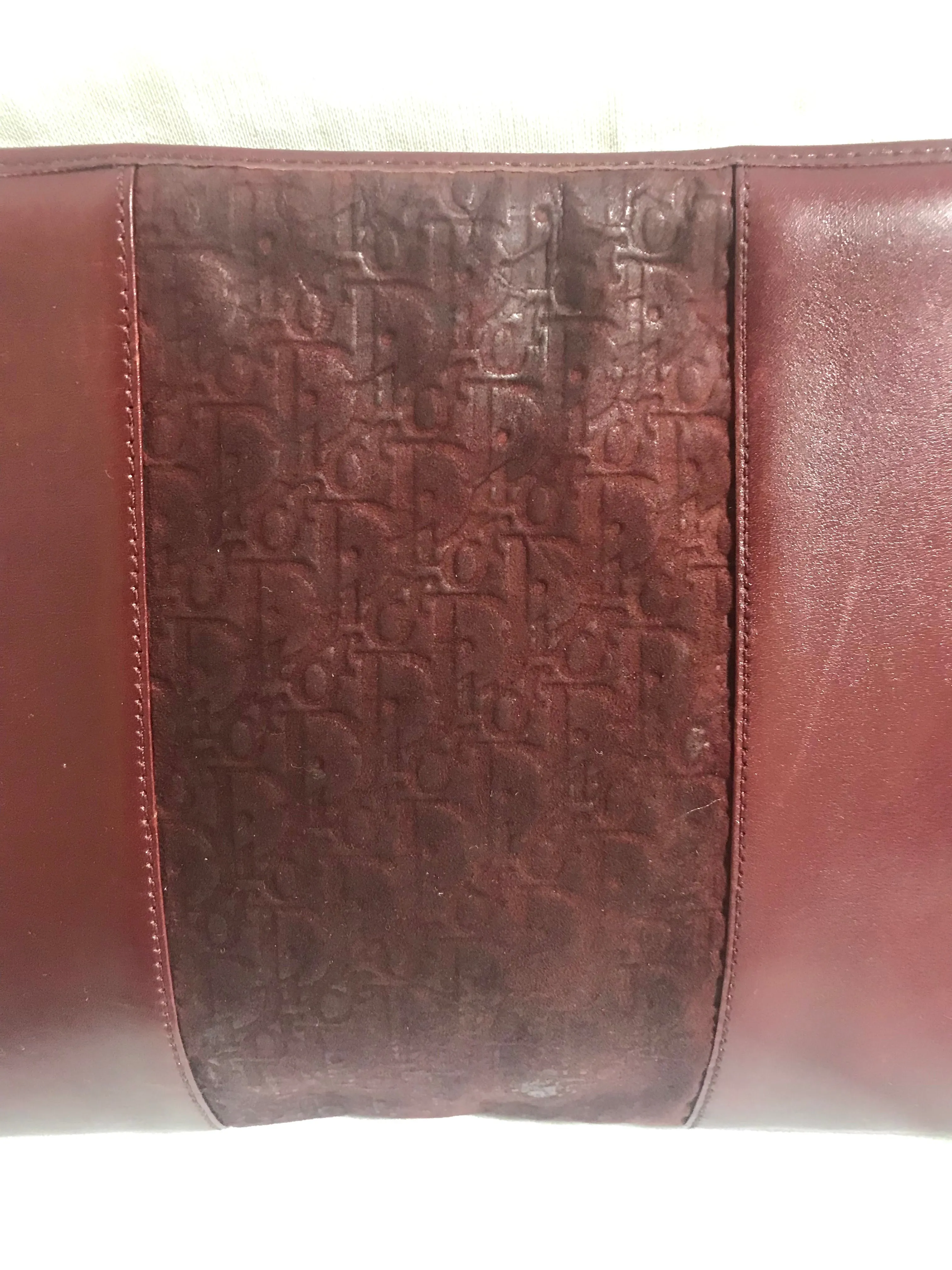 Vintage Christian Dior wine red leather clutch shoulder bag with engraved logo at center. Classic and beautiful purse. 060905r4
