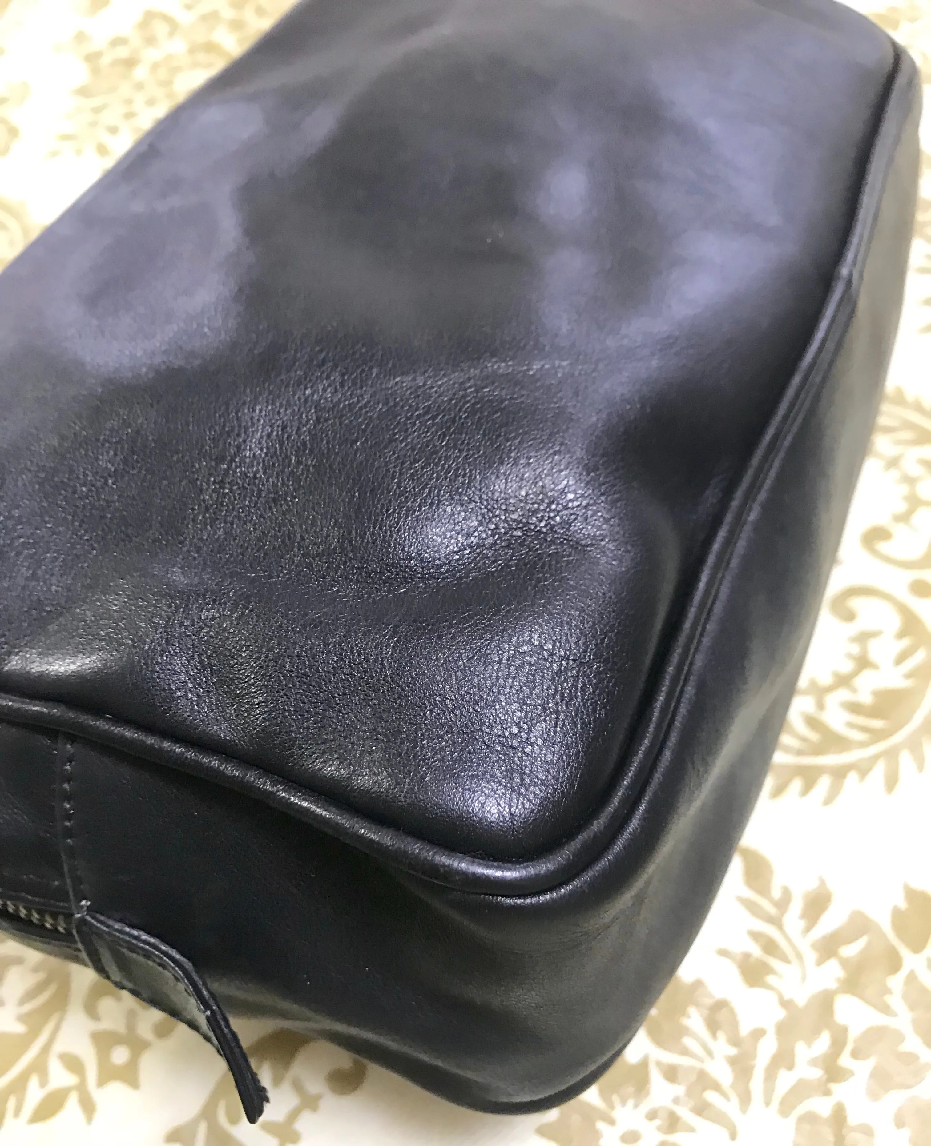 Vintage Gianni Versace black leather purse pouch, case bag with its iconic medusa face and golden logo motif charm. Unisex bag. 061122re1