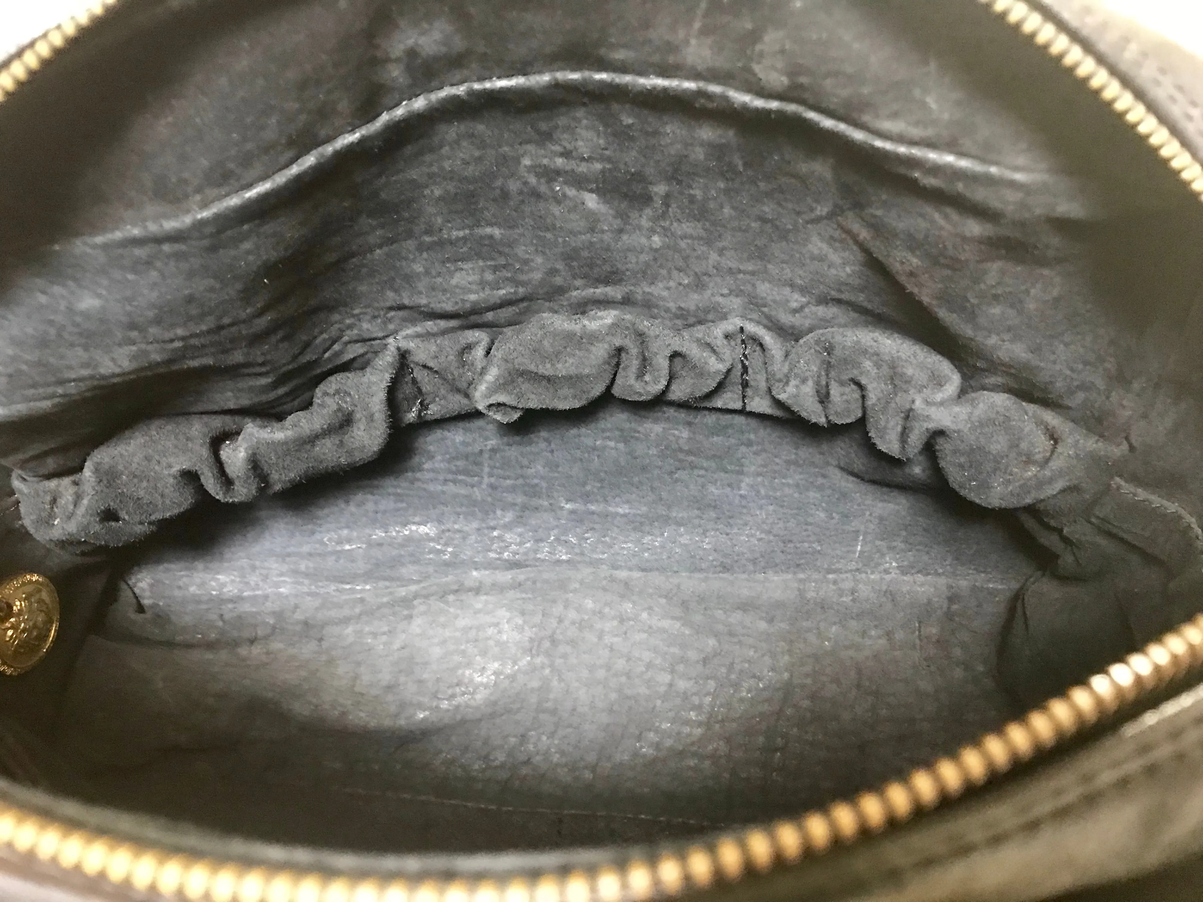 Vintage Gianni Versace black leather purse pouch, case bag with its iconic medusa face and golden logo motif charm. Unisex bag. 061122re1