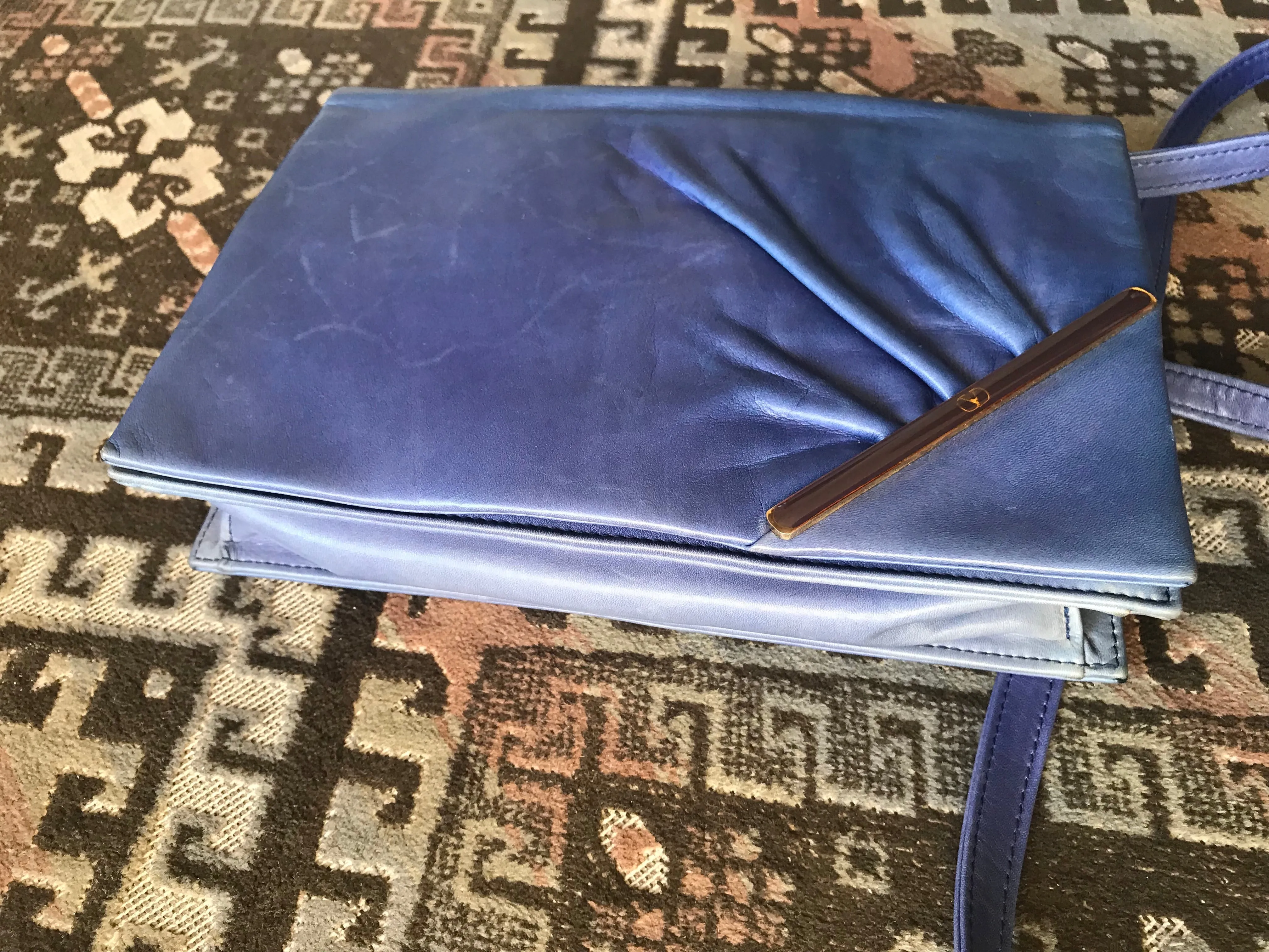 Vintage Valentino Garavani blue leather clutch shoulder bag with brown and golden logo plate at front. Gathered design.