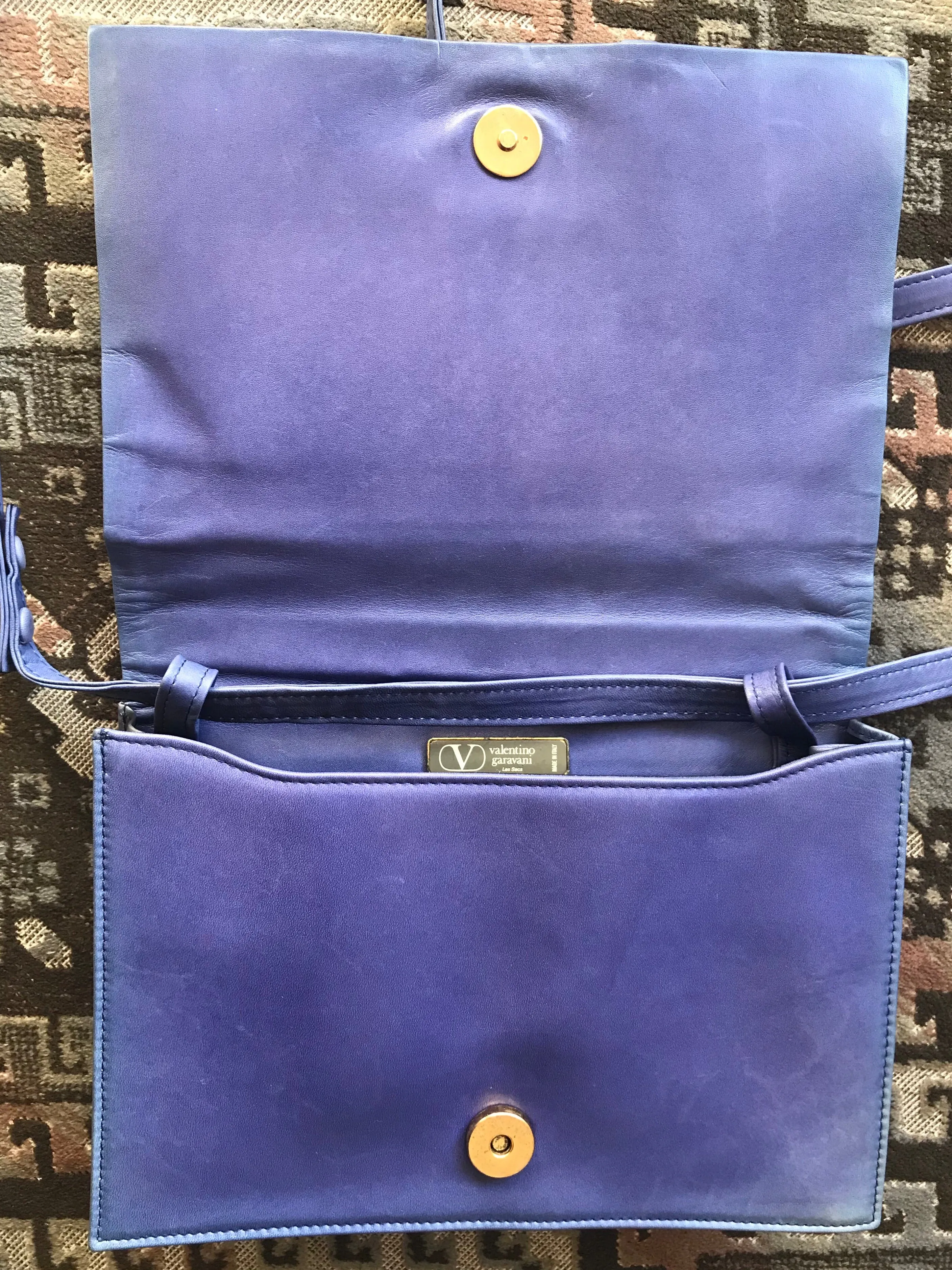 Vintage Valentino Garavani blue leather clutch shoulder bag with brown and golden logo plate at front. Gathered design.