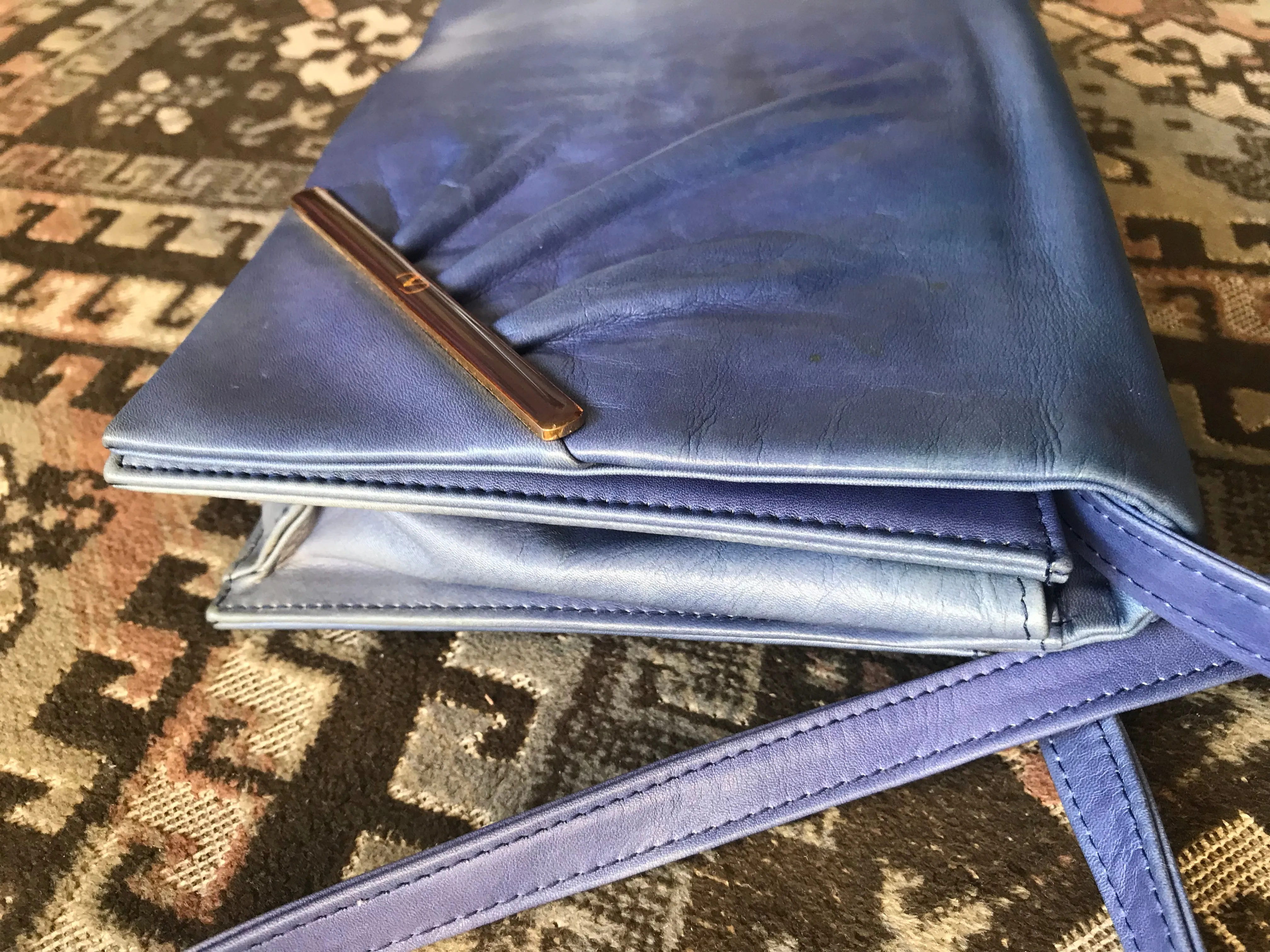 Vintage Valentino Garavani blue leather clutch shoulder bag with brown and golden logo plate at front. Gathered design.