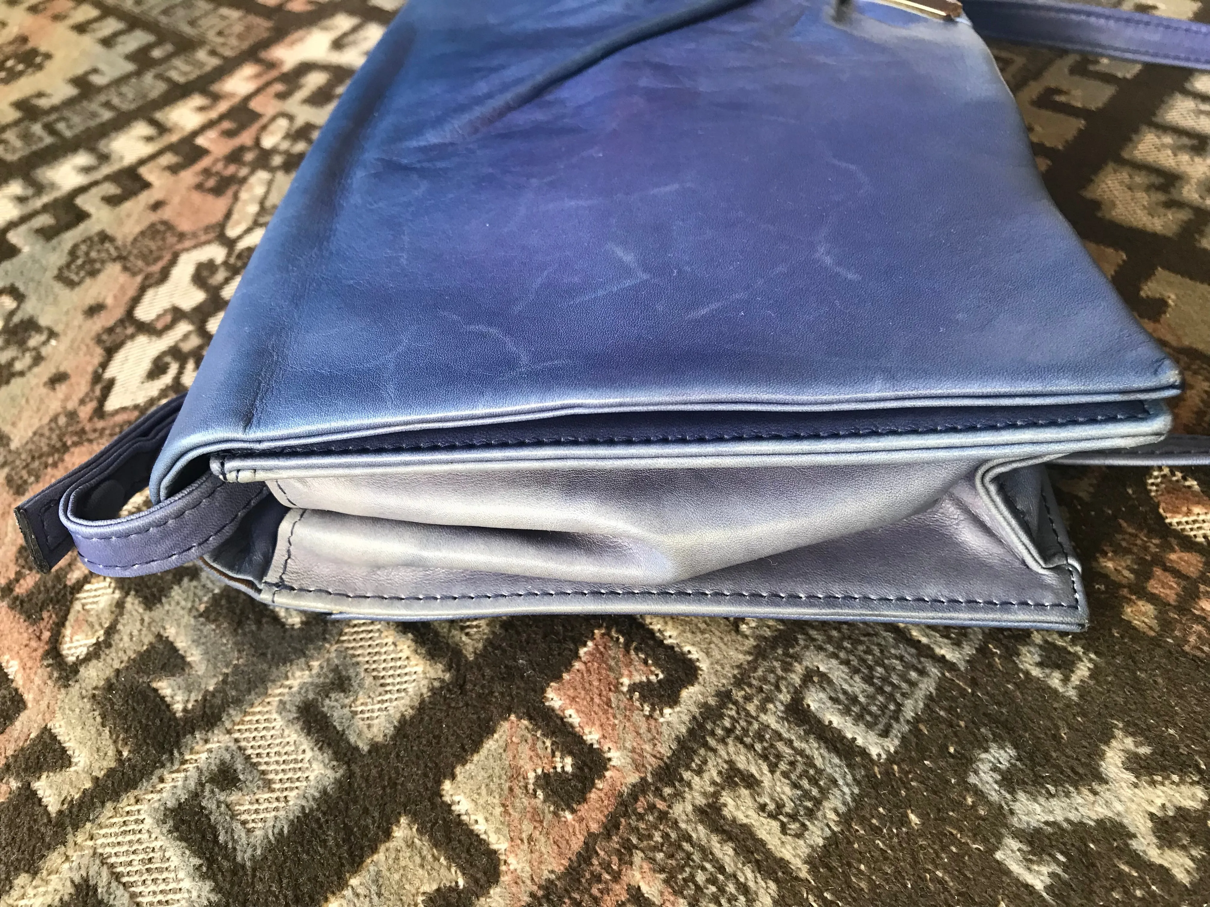Vintage Valentino Garavani blue leather clutch shoulder bag with brown and golden logo plate at front. Gathered design.