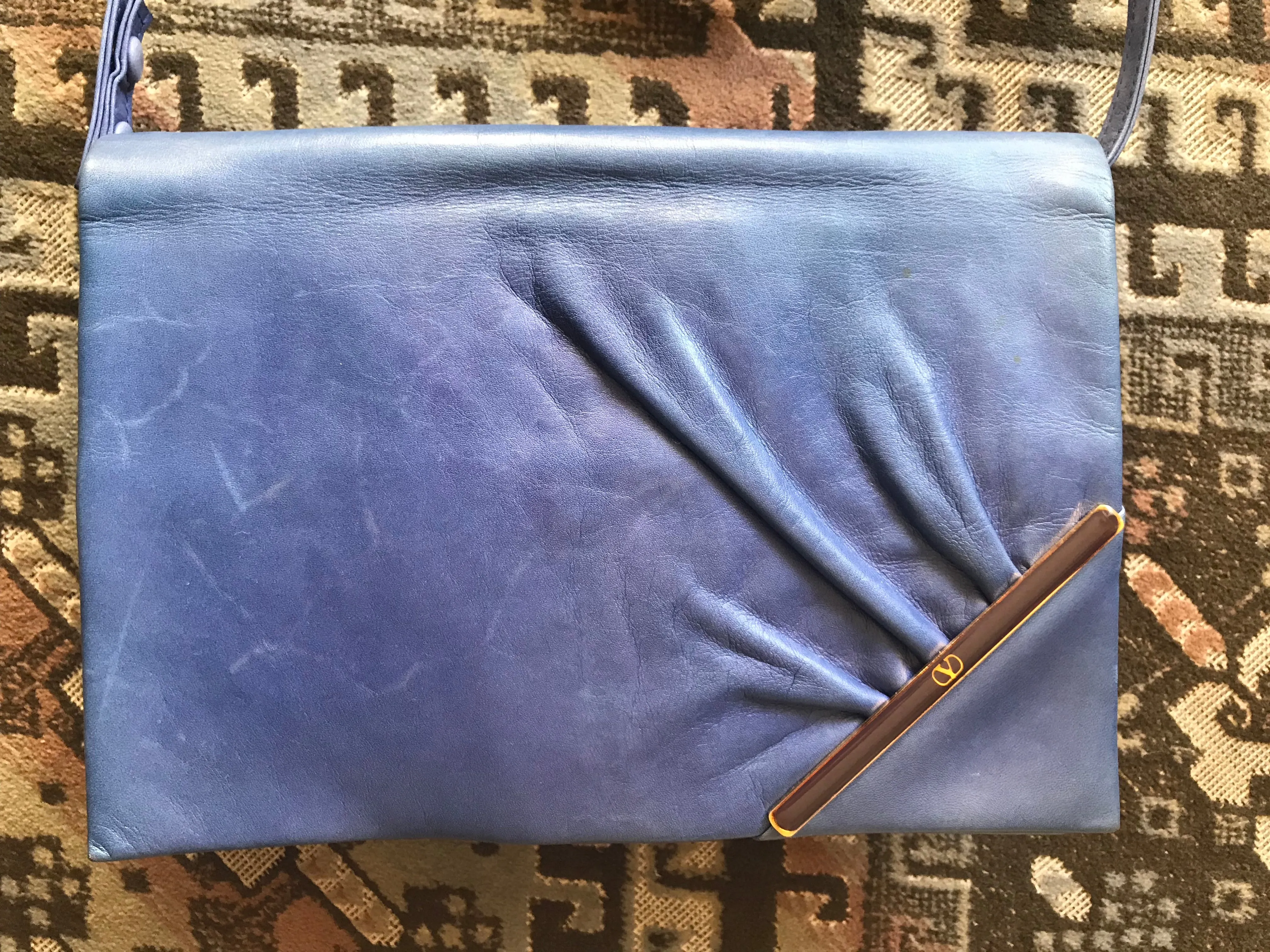 Vintage Valentino Garavani blue leather clutch shoulder bag with brown and golden logo plate at front. Gathered design.