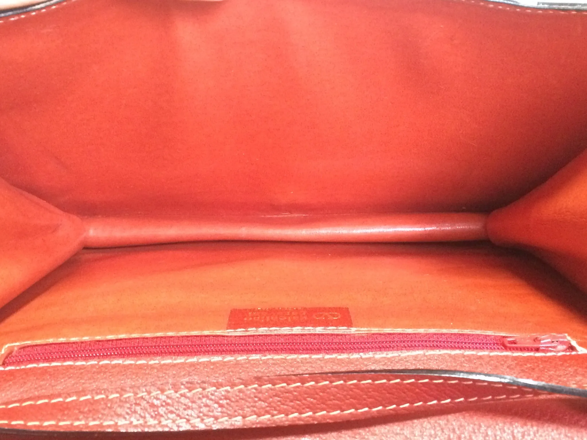 Vintage Valentino Garavani red pigskin shoulder clutch bag with unique logo stitch mark.