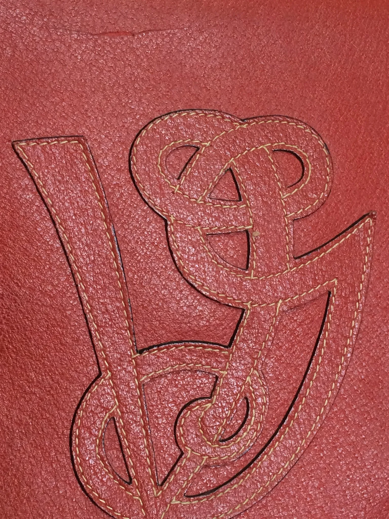Vintage Valentino Garavani red pigskin shoulder clutch bag with unique logo stitch mark.