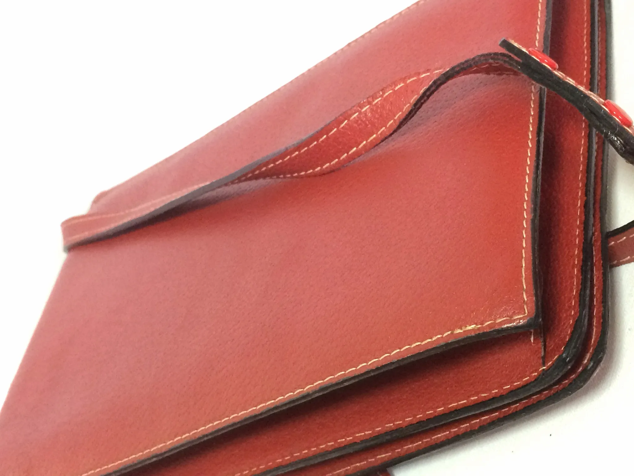 Vintage Valentino Garavani red pigskin shoulder clutch bag with unique logo stitch mark.